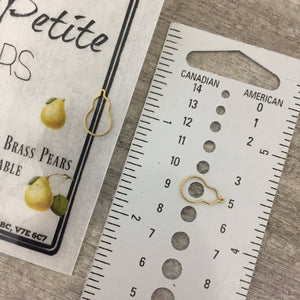 Tiny brass pear shaped stitch marker and pear progress keeper.